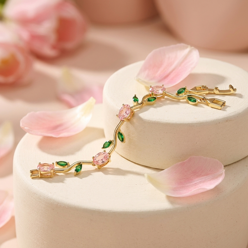 Fleurelle Tulp Armband in goud met roze kristallen tulpen en groene blaadjes op creme ondergrond